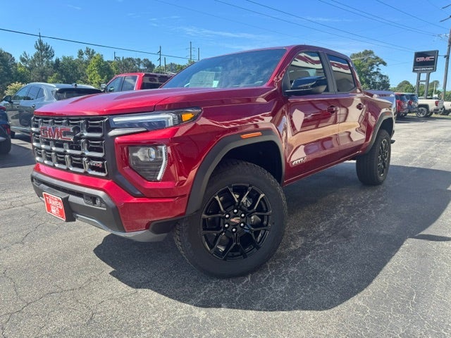 2026 GMC Canyon AT4 in Volcanic Red Tintcoat — front three-quarter view