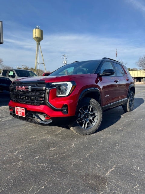 2026 GMC Terrain AT4 in Volcanic Red Tintcoat — front three-quarter view